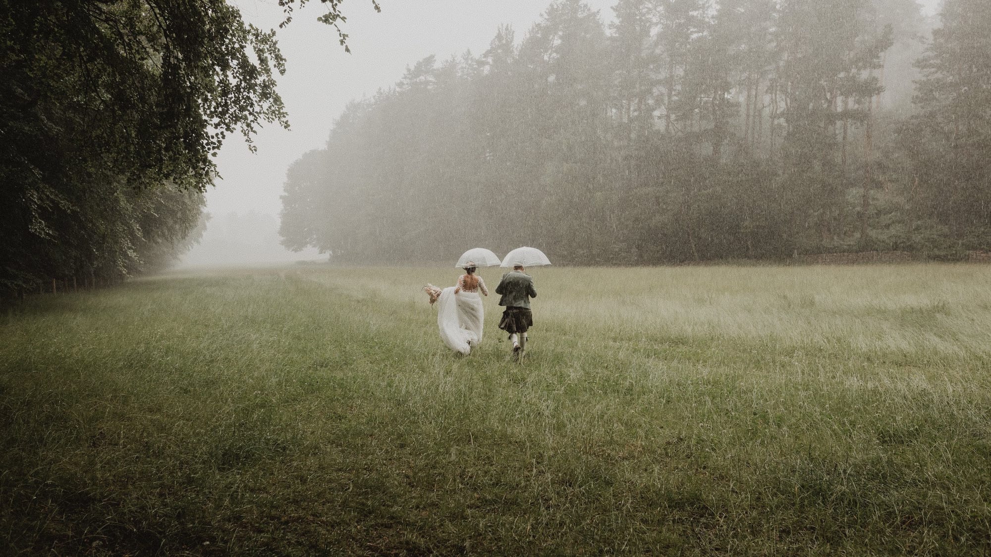 Running through a misty field in the rain